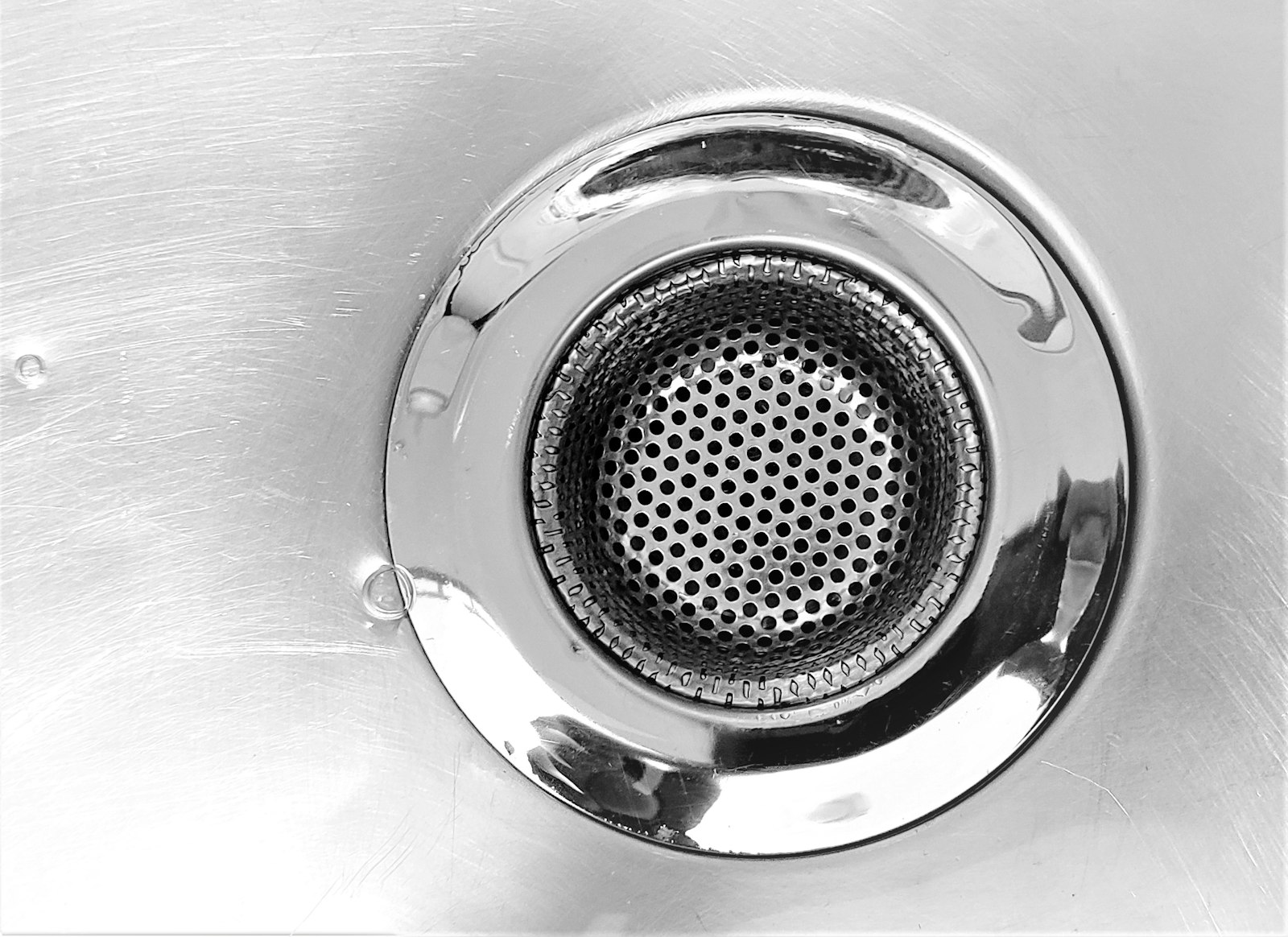Close-up of a stainless steel sink drain strainer